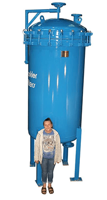Large blue horizontal plate filter with a clamped lid, shown with a person standing beside it for size reference.