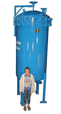 Large blue horizontal plate filter with a clamped lid, shown with a person standing beside it for size reference.